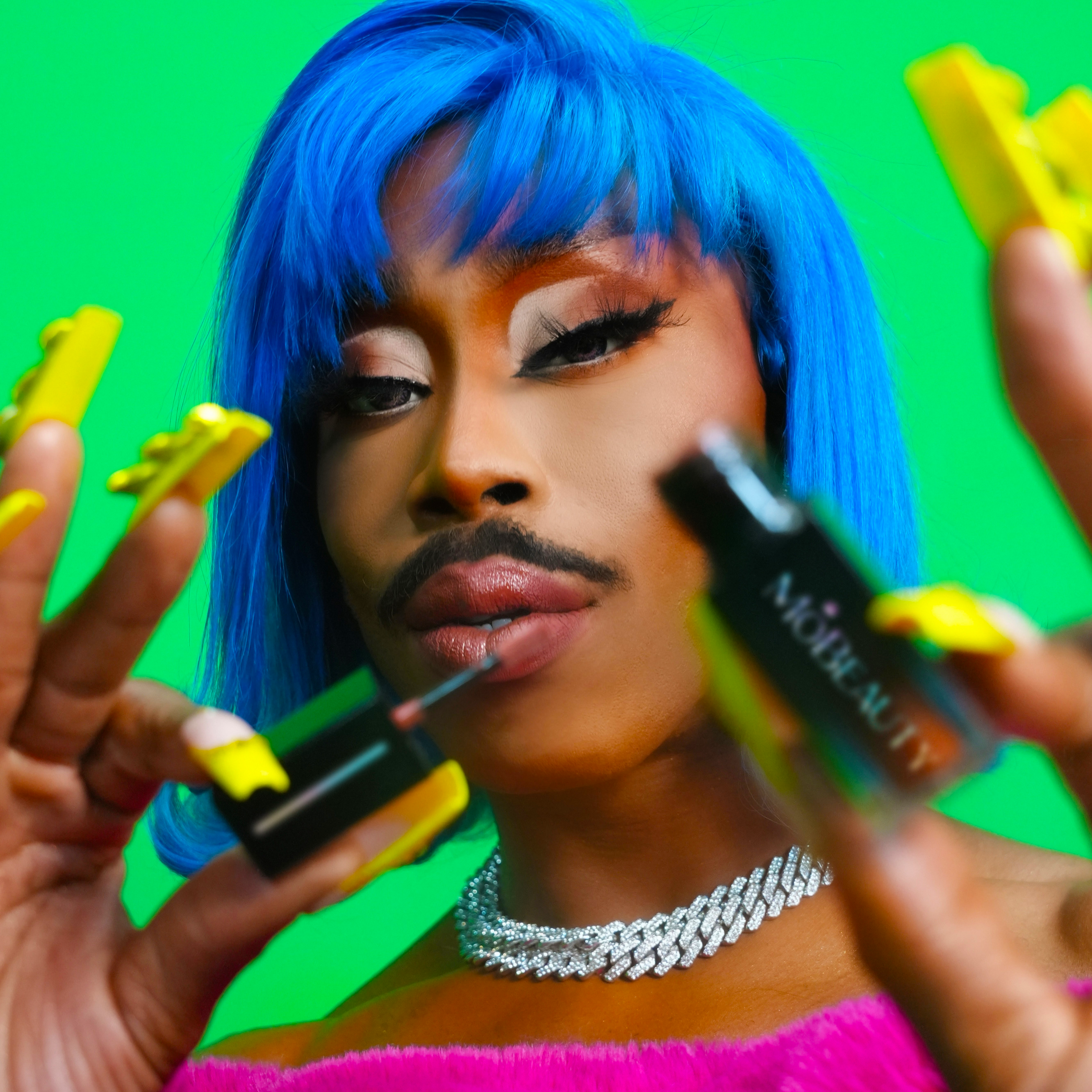 Model image of Mo Heart wearing Mo-Beauty Shop's Mo-Shine Lip Gloss.