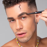 Model applying Mo-Beauty Shop's Divinely Defined Thick, Angled Tip Brow Pencil + Brush in the Dark Brown shade.