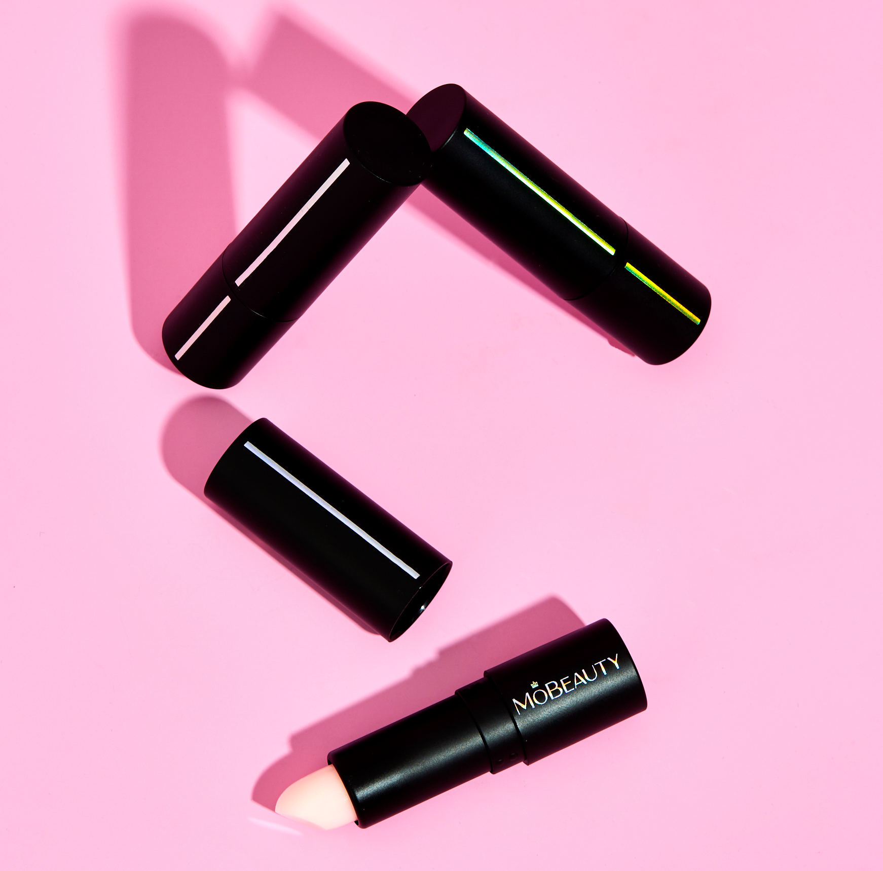 Stylized product image of Mo-Beauty Shop's Sheer Conditioning Lip Balm.