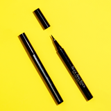 Product image with an open and closed tube of Mo-Beauty Shop's Slick And Stick Black Lash Glue Eyeliner.
