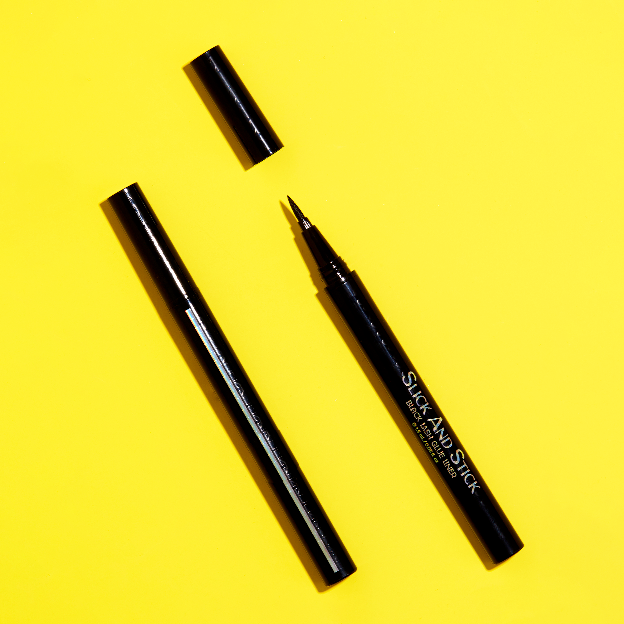 Product image with an open and closed tube of Mo-Beauty Shop's Slick And Stick Black Lash Glue Eyeliner.
