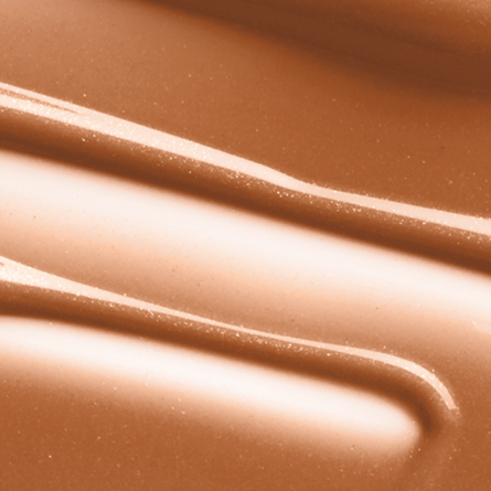 Close-up swatch image of Mo-Beauty Shop's Mo-Shine Lip Gloss in the shade Baby Brown Cow, a soft mauve-nude shade.