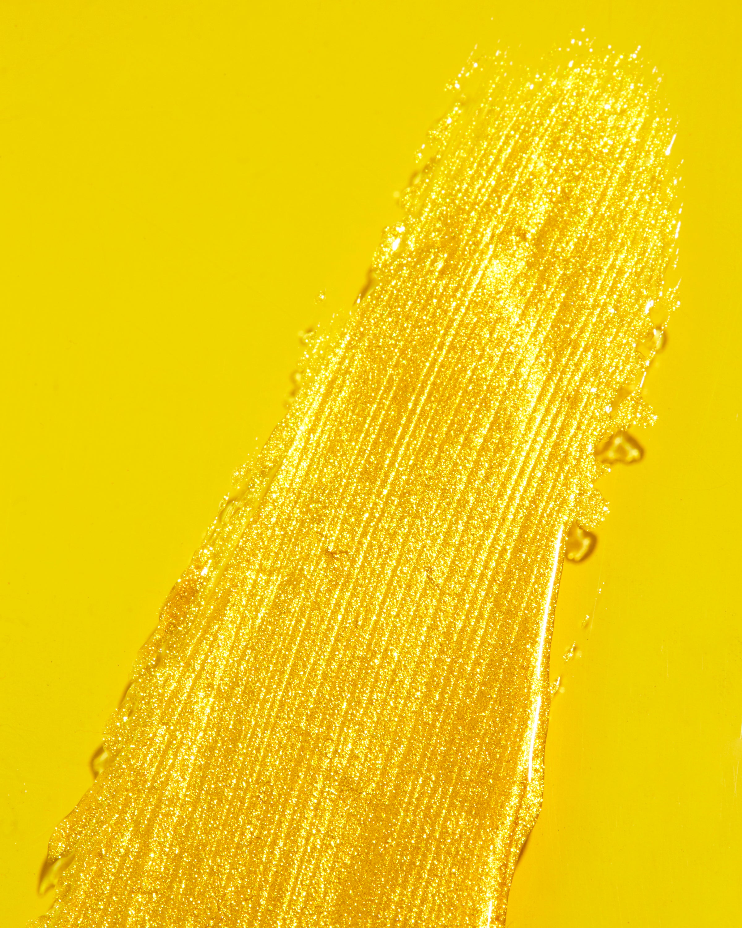 Close-up swatch image of Mo-Beauty Shop's Gimme Mo-Glow All-Over Highlighter in the Gold shade.