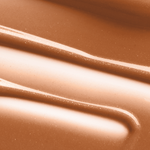 Close-up swatch image of Mo-Beauty Shop's Mo-Shine Lip Gloss in the shade Baby Brown Cow, a soft mauve-nude shade.