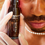 Model image wearing Mo-Beauty Shop's Set It Up Setting Spray.