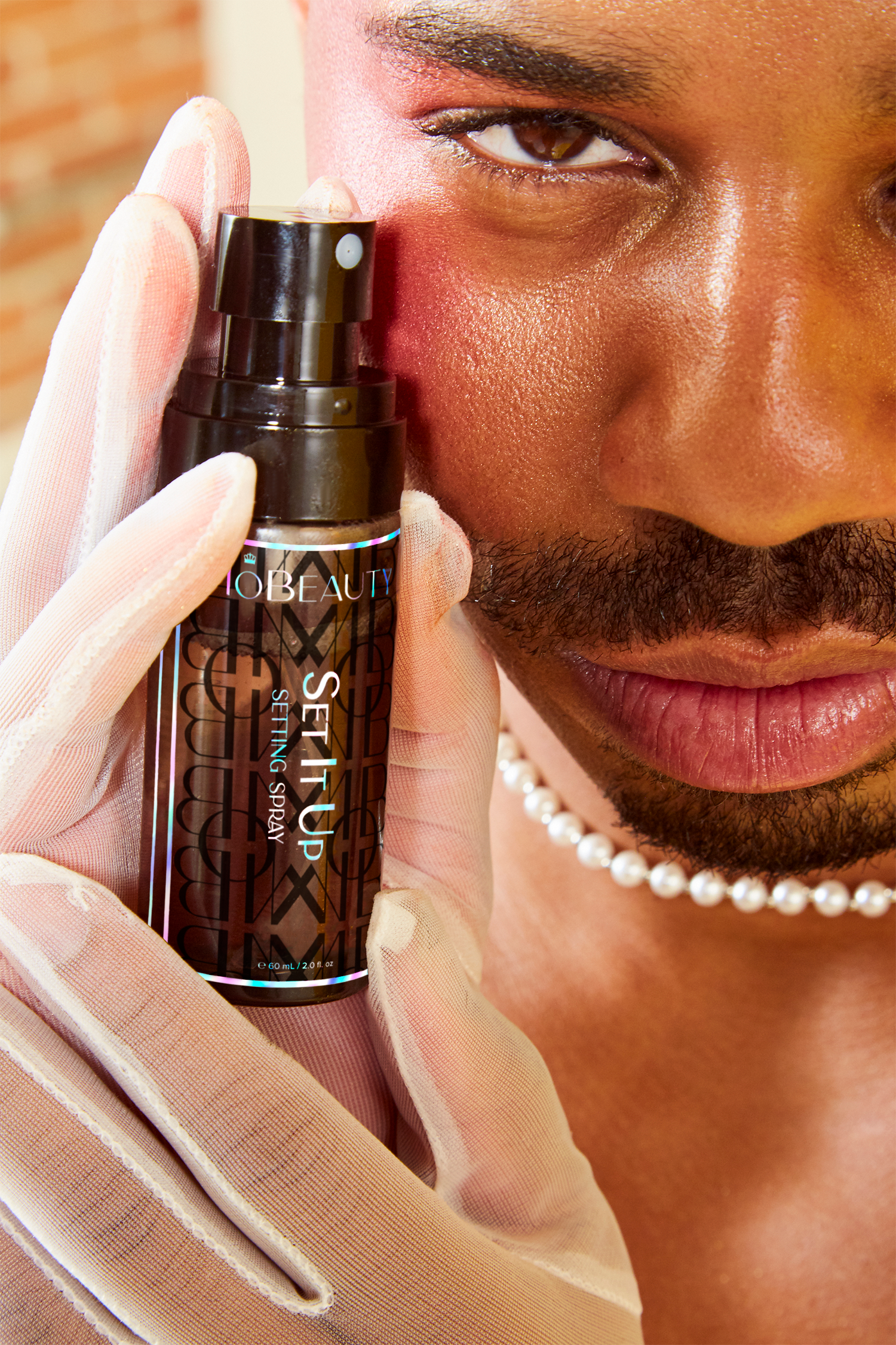 Model image wearing Mo-Beauty Shop's Set It Up Setting Spray.